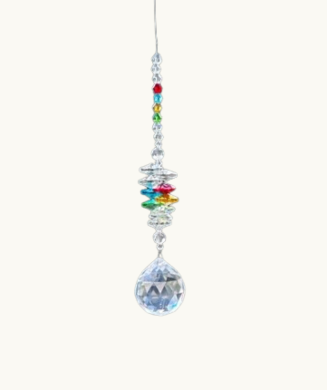 Crystal Chakra Sun Catcher With Many Colours Of Crystal Shown Against A White Background