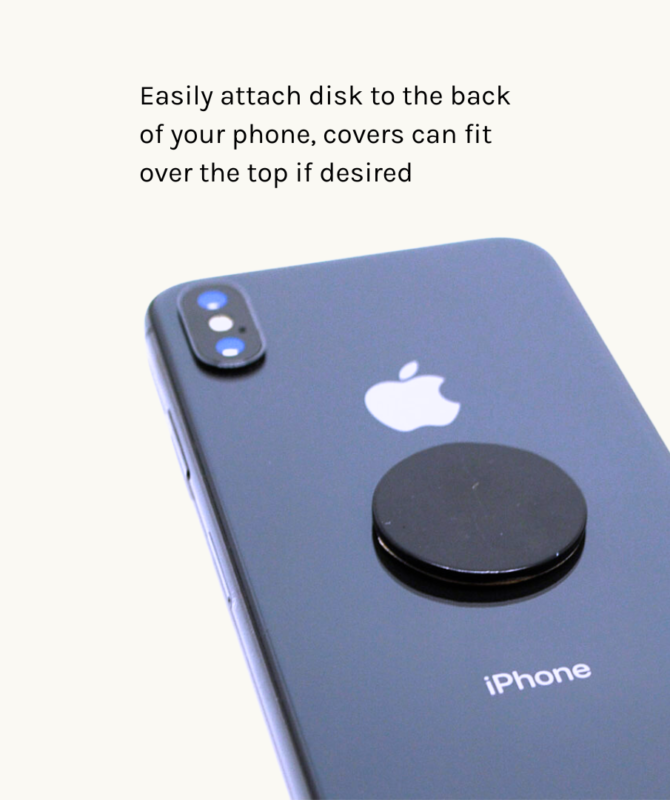 Shungite Mobile Phone Protection Disk Shown On The Back Of An Dark Coloured Apple Iphone